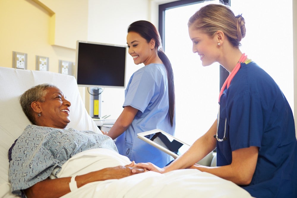 Nurse practitioner consulting with a patient in her private clinic
